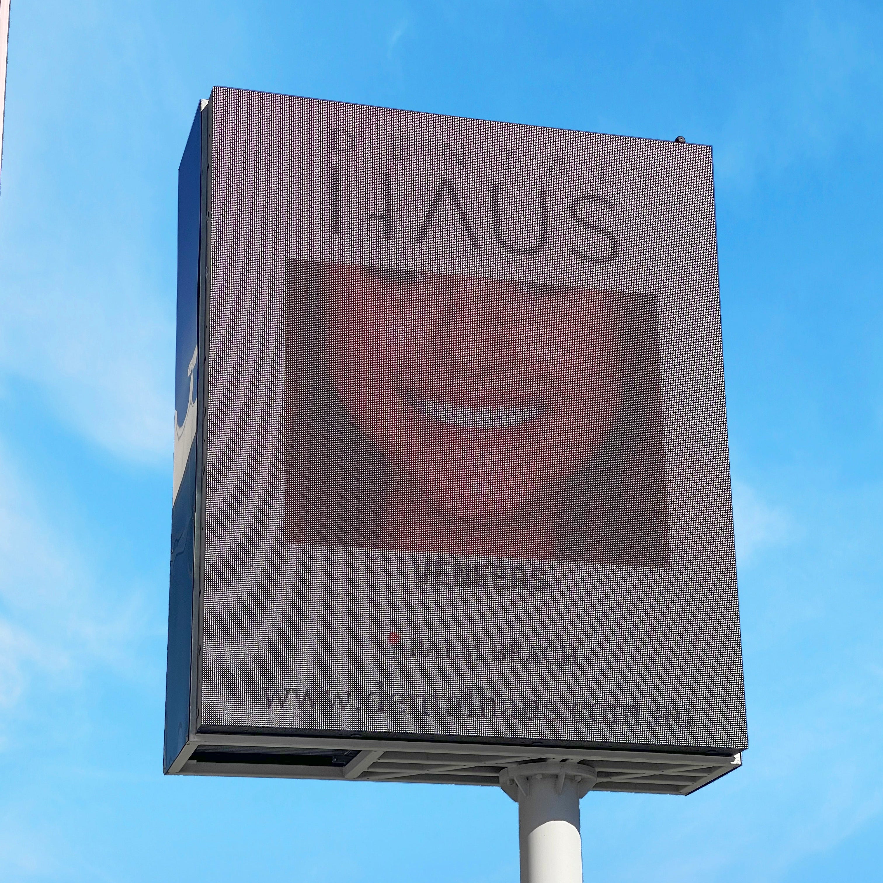 Billboard for Dental Haus with a mouth graphic and contact information against a blue sky.